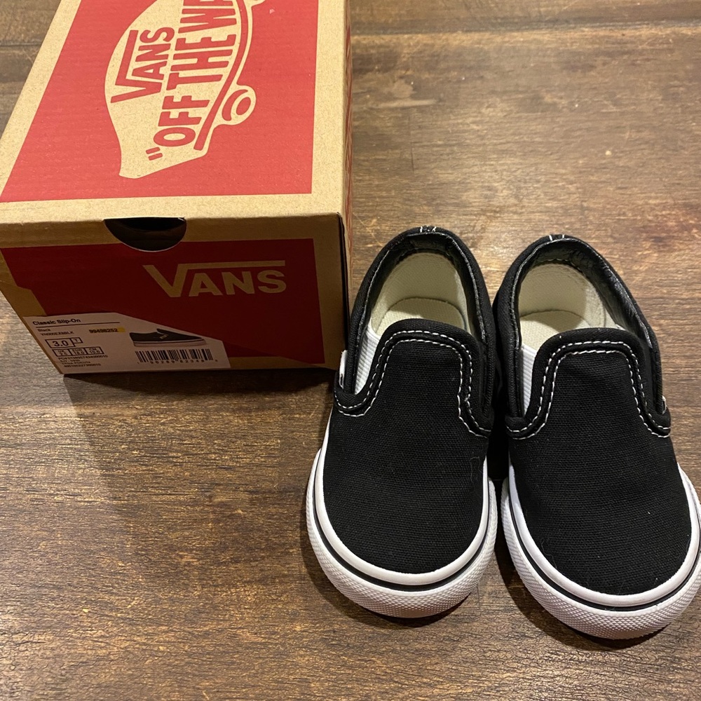 Like new black Vans slip ons